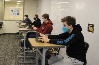 Sophomore boys study in a classroom